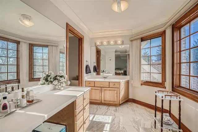 a bed room with a bed and a ceiling fan