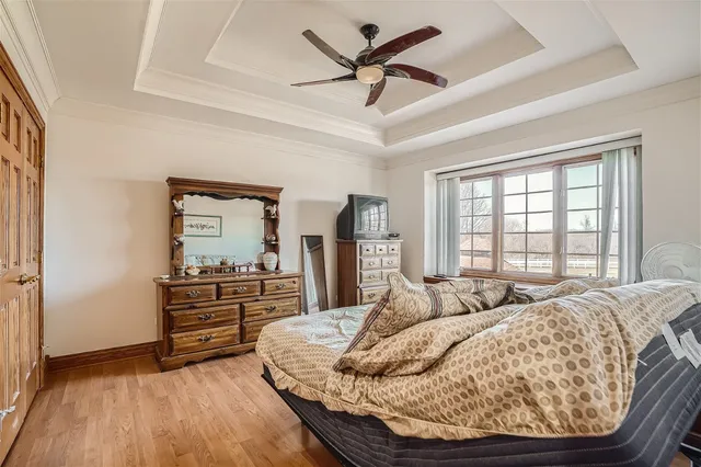 a bedroom with a bed and a night stand