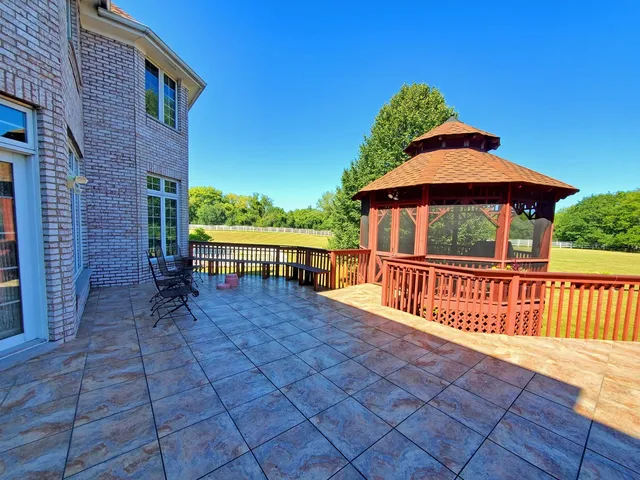 a view of a swimming pool and a yard