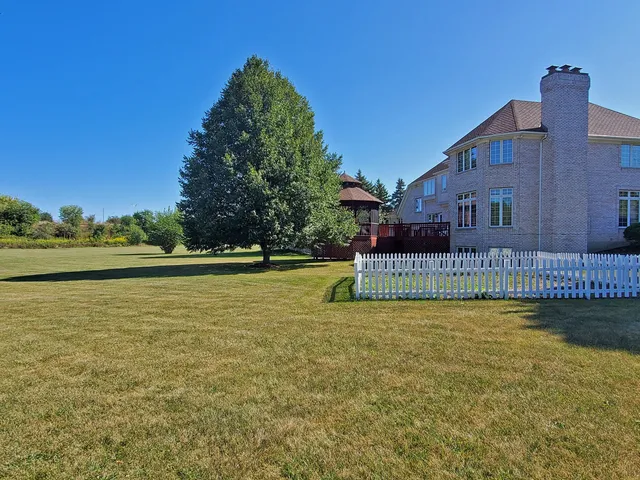 a view of a house with a garden and plants