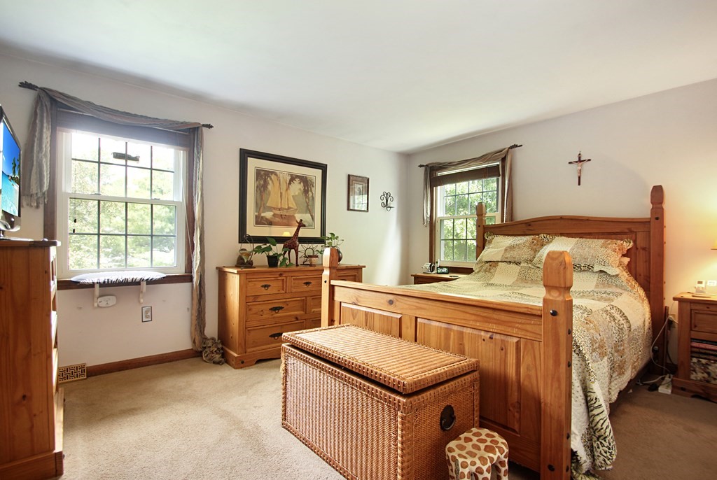 12 Indian Rock Road Haverhill, MA 01832 - Photo 11 of 31 a bedroom with a bed and a dresser