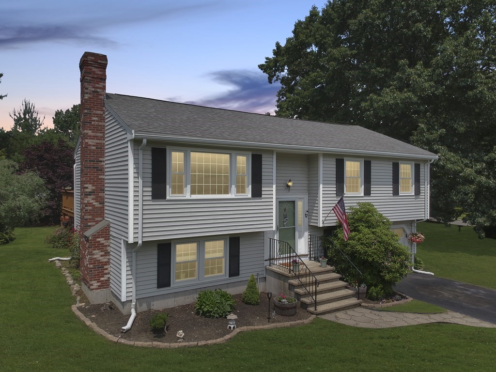 12 Indian Rock Road Haverhill, MA 01832 - Photo 2 of 31 a front view of a house with a garden and yard