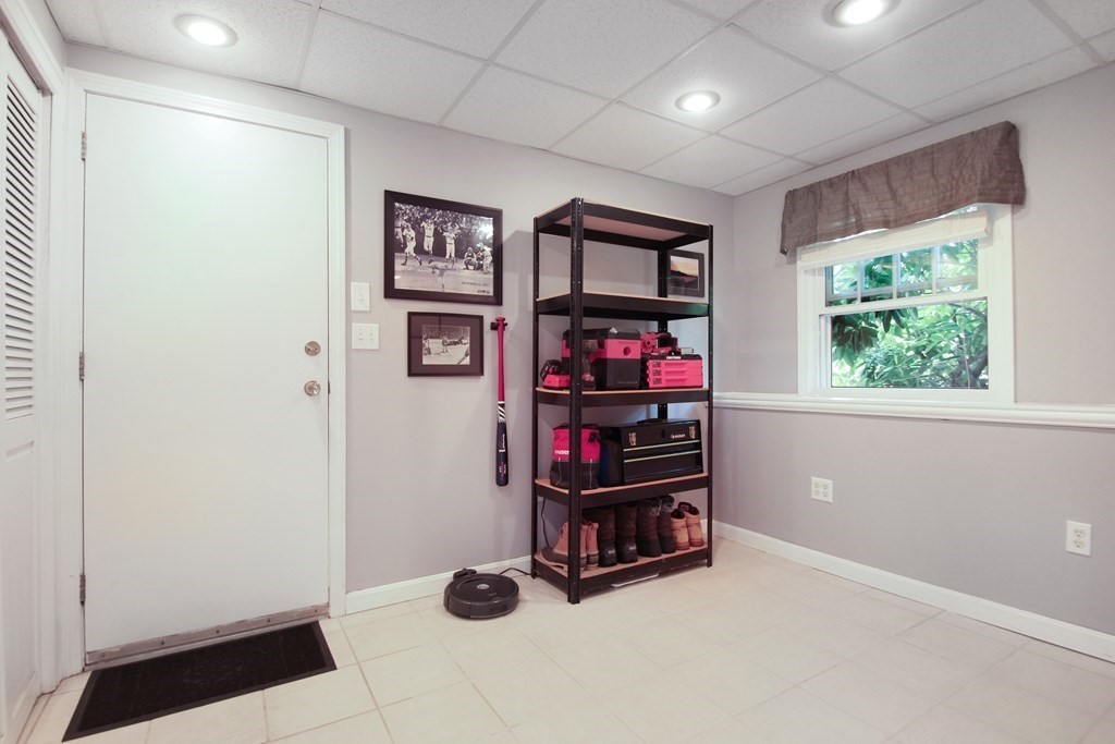 12 Indian Rock Road Haverhill, MA 01832 - Photo 23 of 31 a room with lots of books and a window
