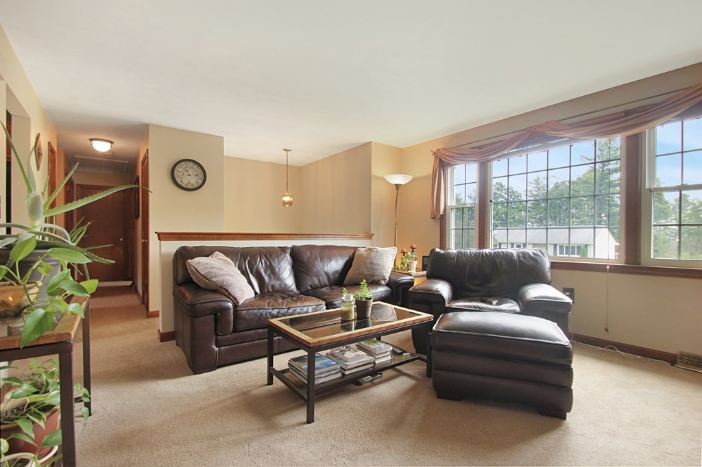 12 Indian Rock Road Haverhill, MA 01832 - Photo 3 of 31 a living room with furniture and a floor to ceiling window