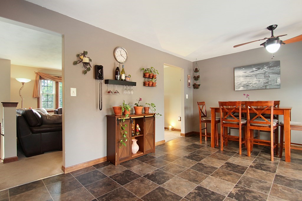 12 Indian Rock Road Haverhill, MA 01832 - Photo 9 of 31 a living room with furniture and a dining table