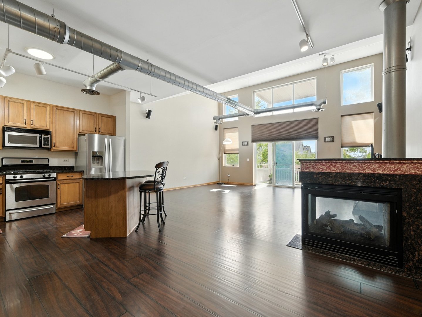 1716 Simms Street Aurora, IL 60504 - Photo 1 of 29 a kitchen with stainless steel appliances a stove top oven a sink and a refrigerator