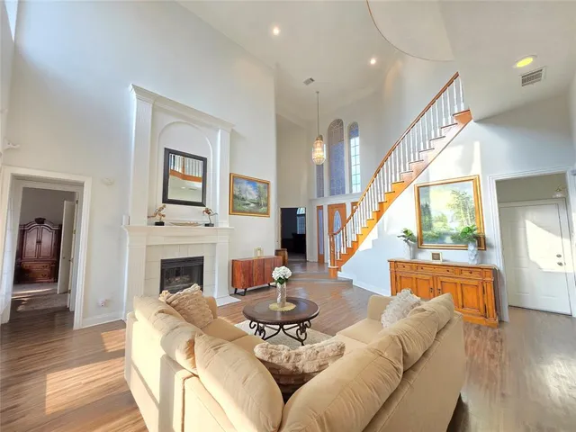 a living room with furniture fireplace and a table