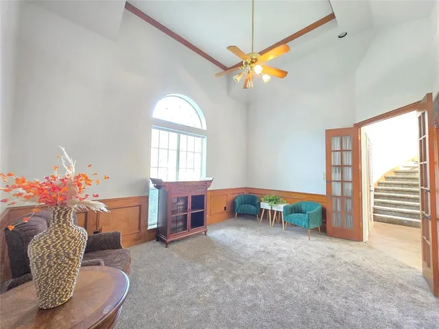 a living room with furniture and a window