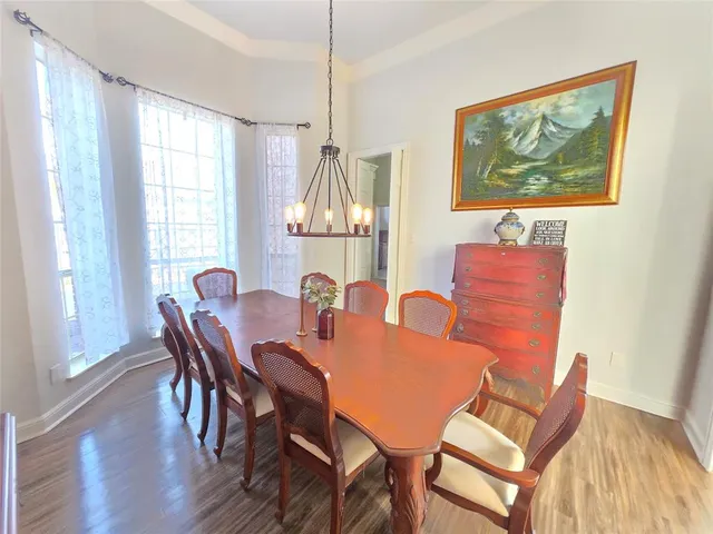 a dining room with furniture and window