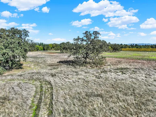 a view of lake with green space