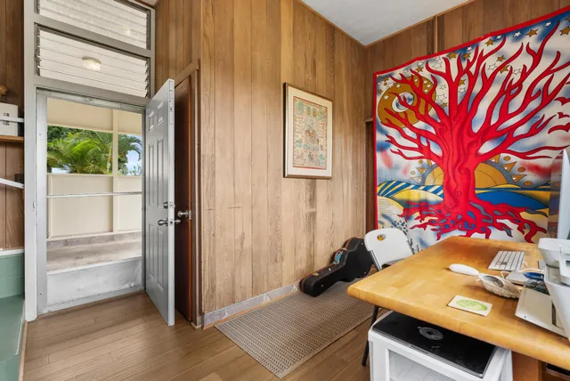 a view of a workspace with furniture and a workspace