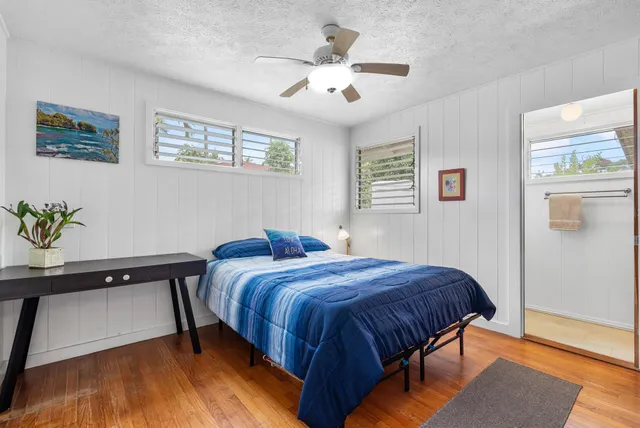 a bedroom with a bed and a table