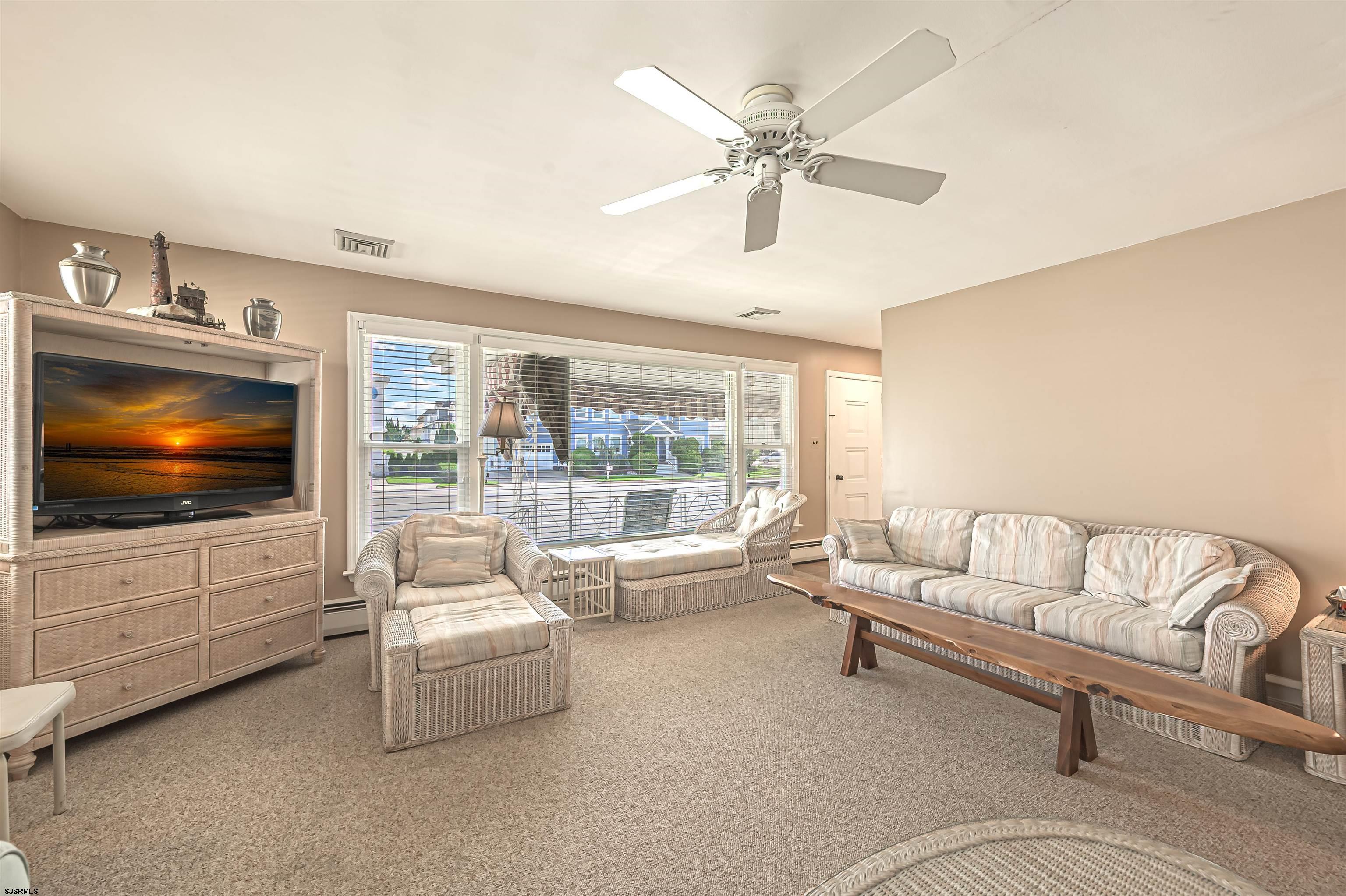 2805 Atlantic Avenue, Unit IDEAL LOCATION Longport, NJ 08403 - Photo 13 of 26 a living room with furniture and a flat screen tv