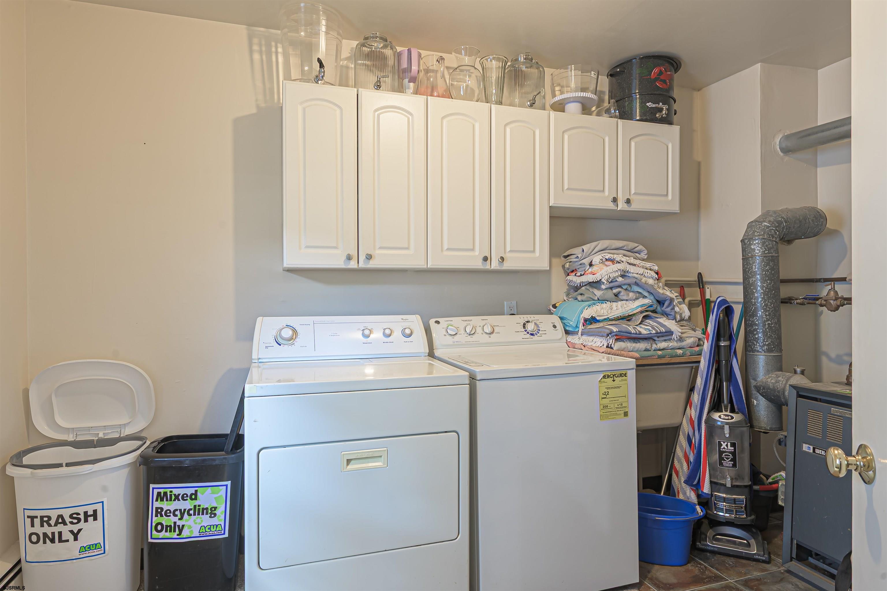 2805 Atlantic Avenue, Unit IDEAL LOCATION Longport, NJ 08403 - Photo 18 of 26 a utility room with dryer and washer