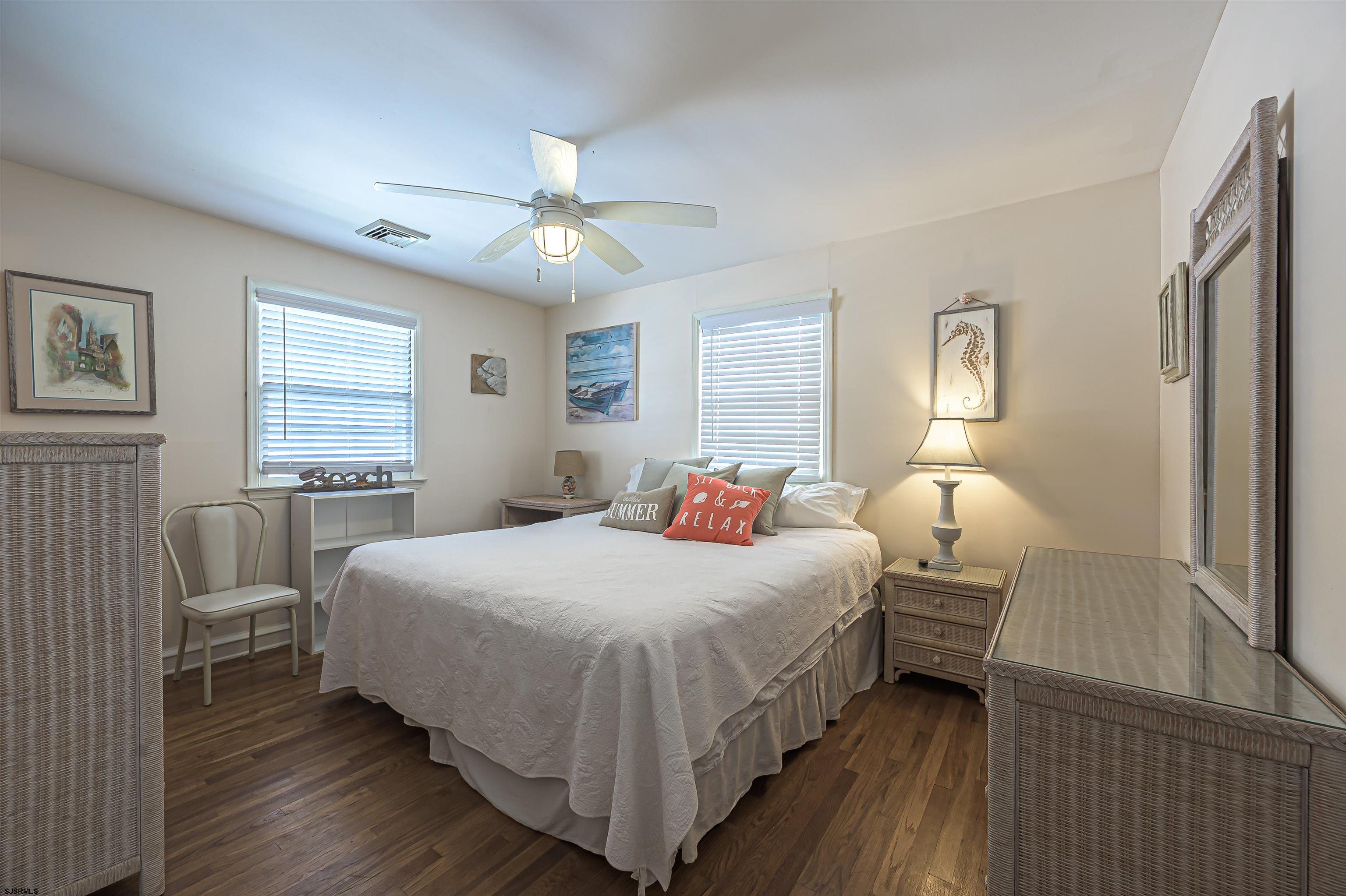 2805 Atlantic Avenue, Unit IDEAL LOCATION Longport, NJ 08403 - Photo 21 of 26 a bedroom with a bed and window