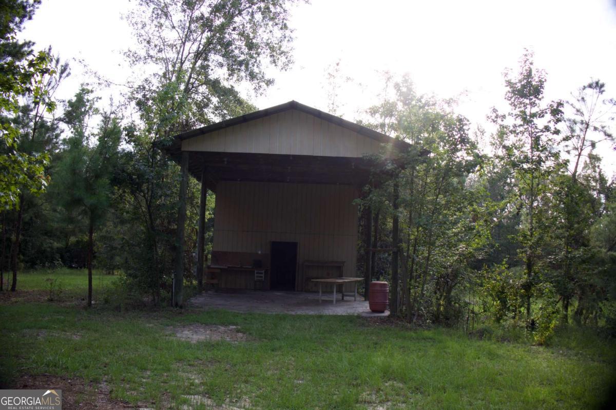 143 Sadie Galbreath Road Vidalia, GA 30474 - Photo 24 of 24 a view of a chair and table in the garden