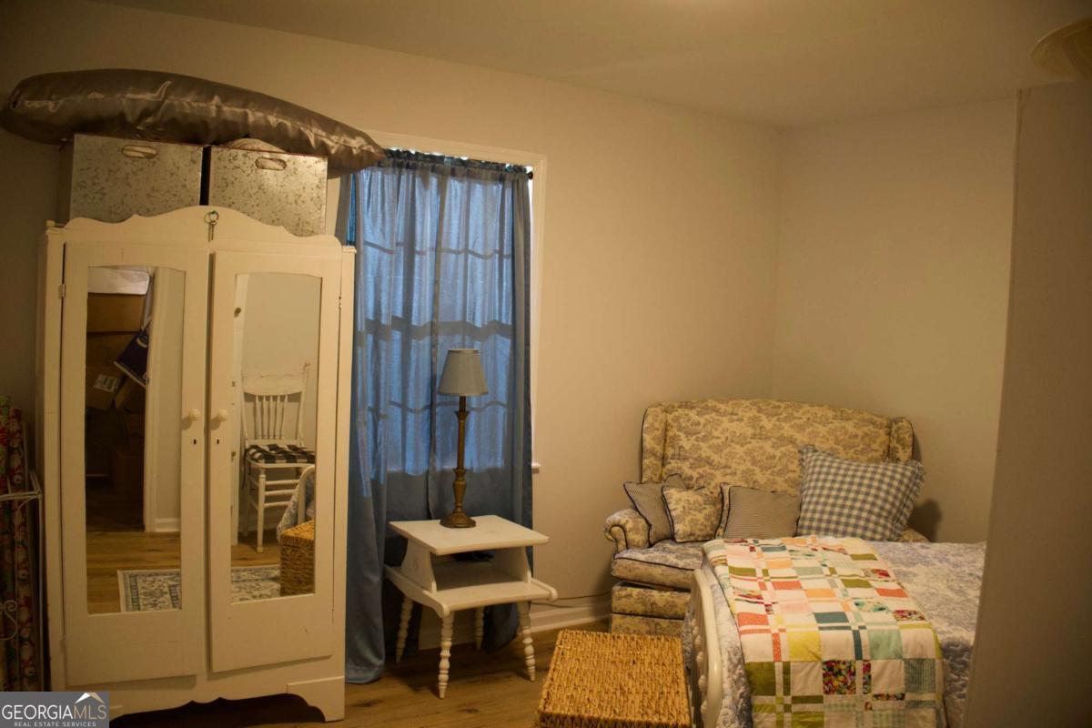 143 Sadie Galbreath Road Vidalia, GA 30474 - Photo 9 of 25 a bedroom with a bed and furniture