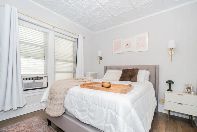 a bedroom with bed and window