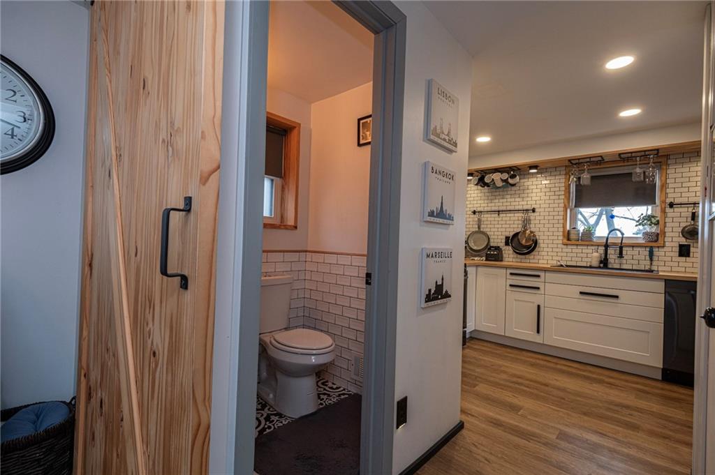 7608 Cheyenne Street Pittsburgh, PA 15218 - Photo 14 of 33 a bathroom with a toilet a sink and mirror