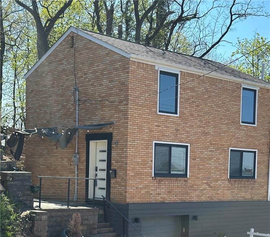 7608 Cheyenne Street Pittsburgh, PA 15218 - Photo 2 of 33 a brick house with four windows