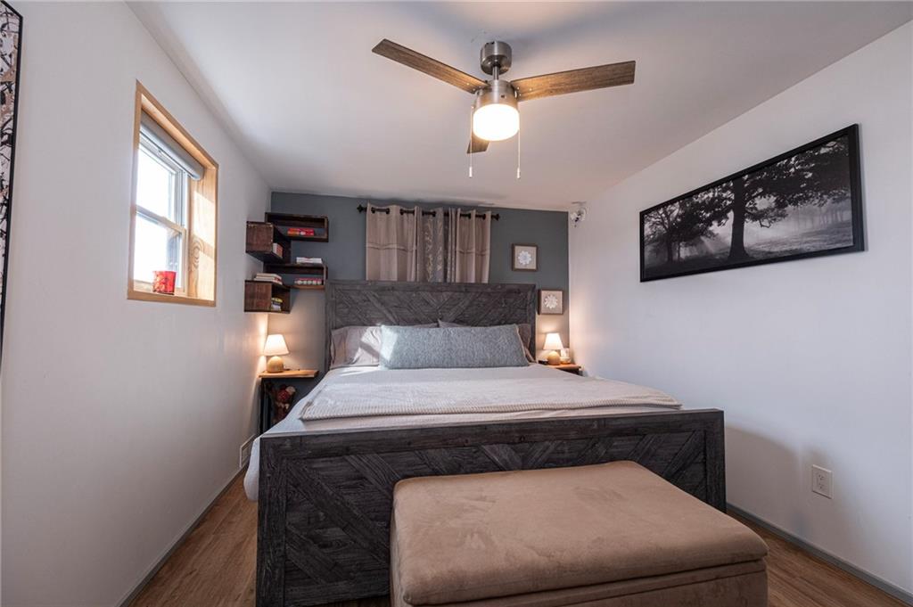 7608 Cheyenne Street Pittsburgh, PA 15218 - Photo 21 of 33 a bedroom with a bed and a window