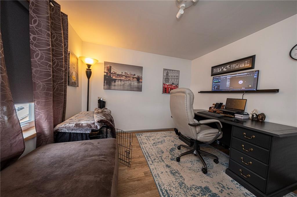 7608 Cheyenne Street Pittsburgh, PA 15218 - Photo 25 of 33 a bedroom with a workspace