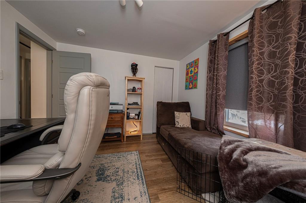 7608 Cheyenne Street Pittsburgh, PA 15218 - Photo 26 of 33 a bedroom with a bed and a mirror