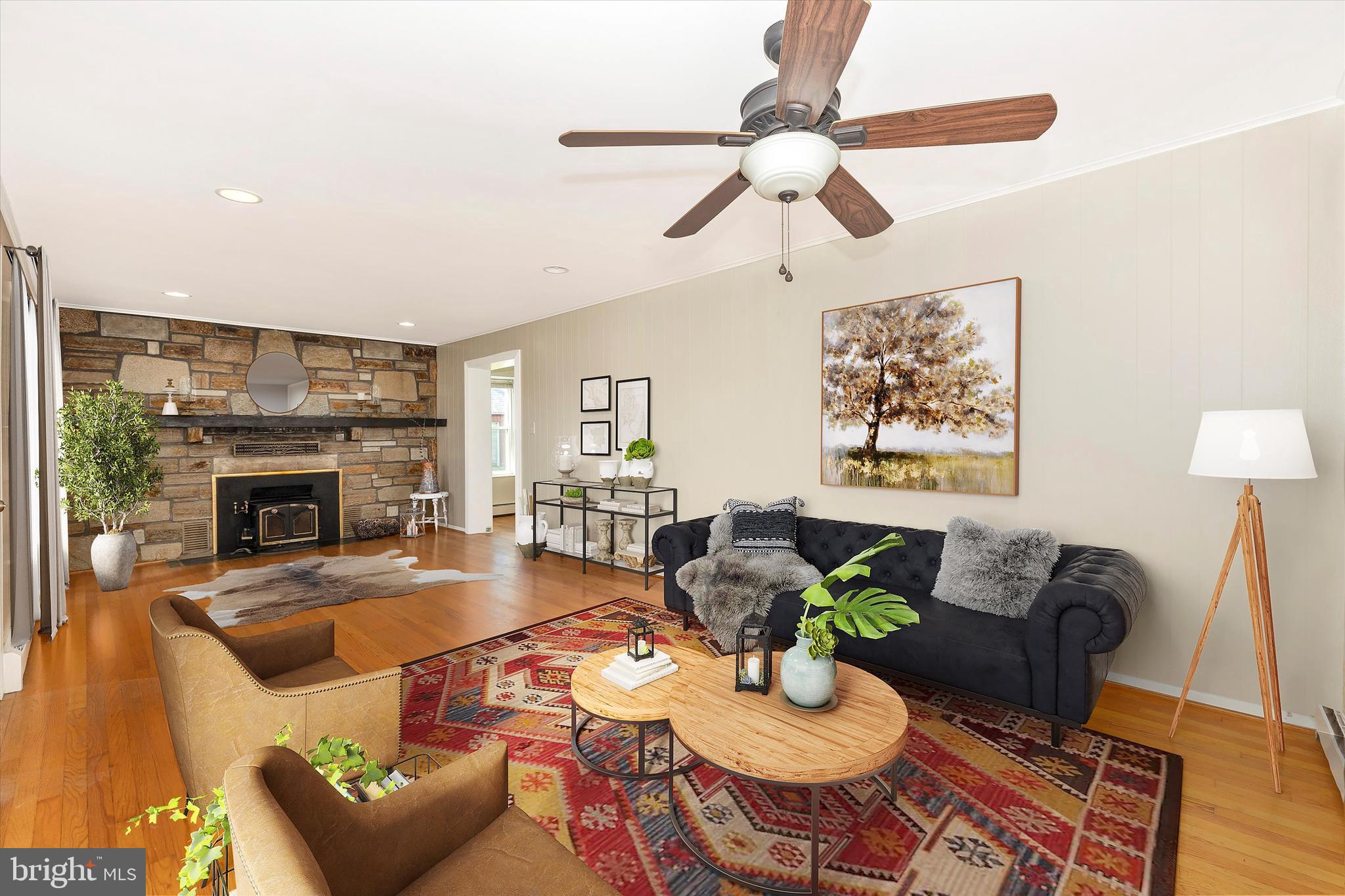 1021 Saffell Road Reisterstown, MD 21136 - Photo 21 of 57 a living room with furniture a fireplace and a table