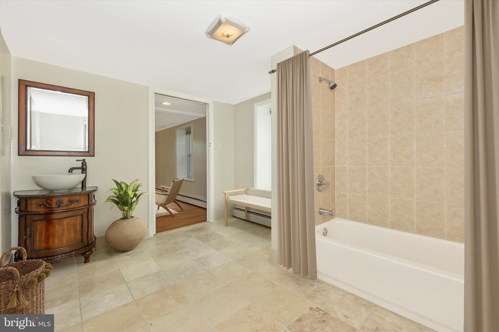 1021 Saffell Road Reisterstown, MD 21136 - Photo 25 of 57 a spacious bathroom with a bathtub shower and a sink