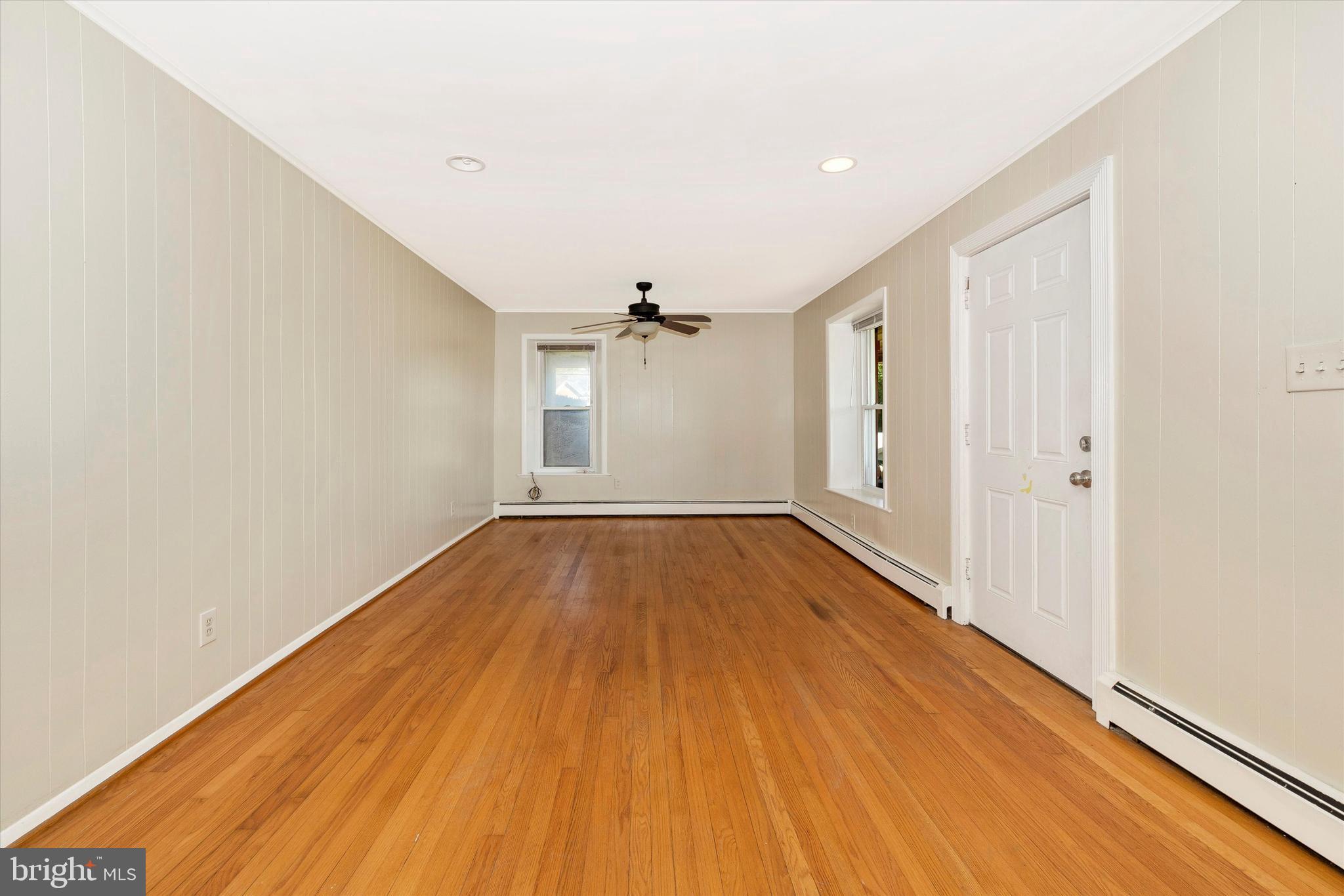 1021 Saffell Road Reisterstown, MD 21136 - Photo 30 of 57 wooden floor in an empty room with a window