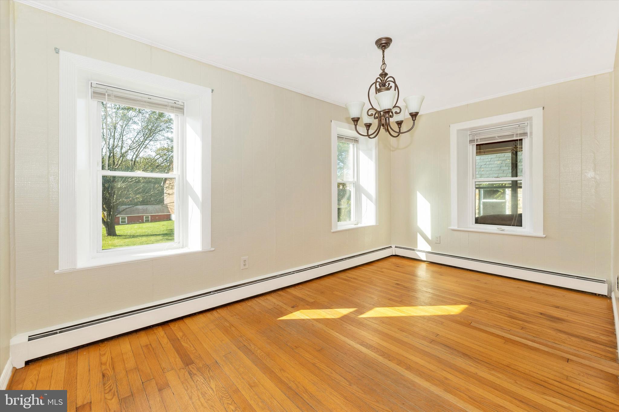 1021 Saffell Road Reisterstown, MD 21136 - Photo 33 of 57 a view of an empty room with wooden floor and a window