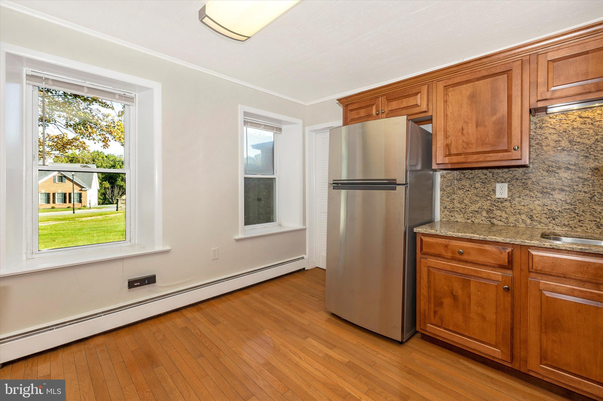 1021 Saffell Road Reisterstown, MD 21136 - Photo 37 of 57 a kitchen with a refrigerator and window