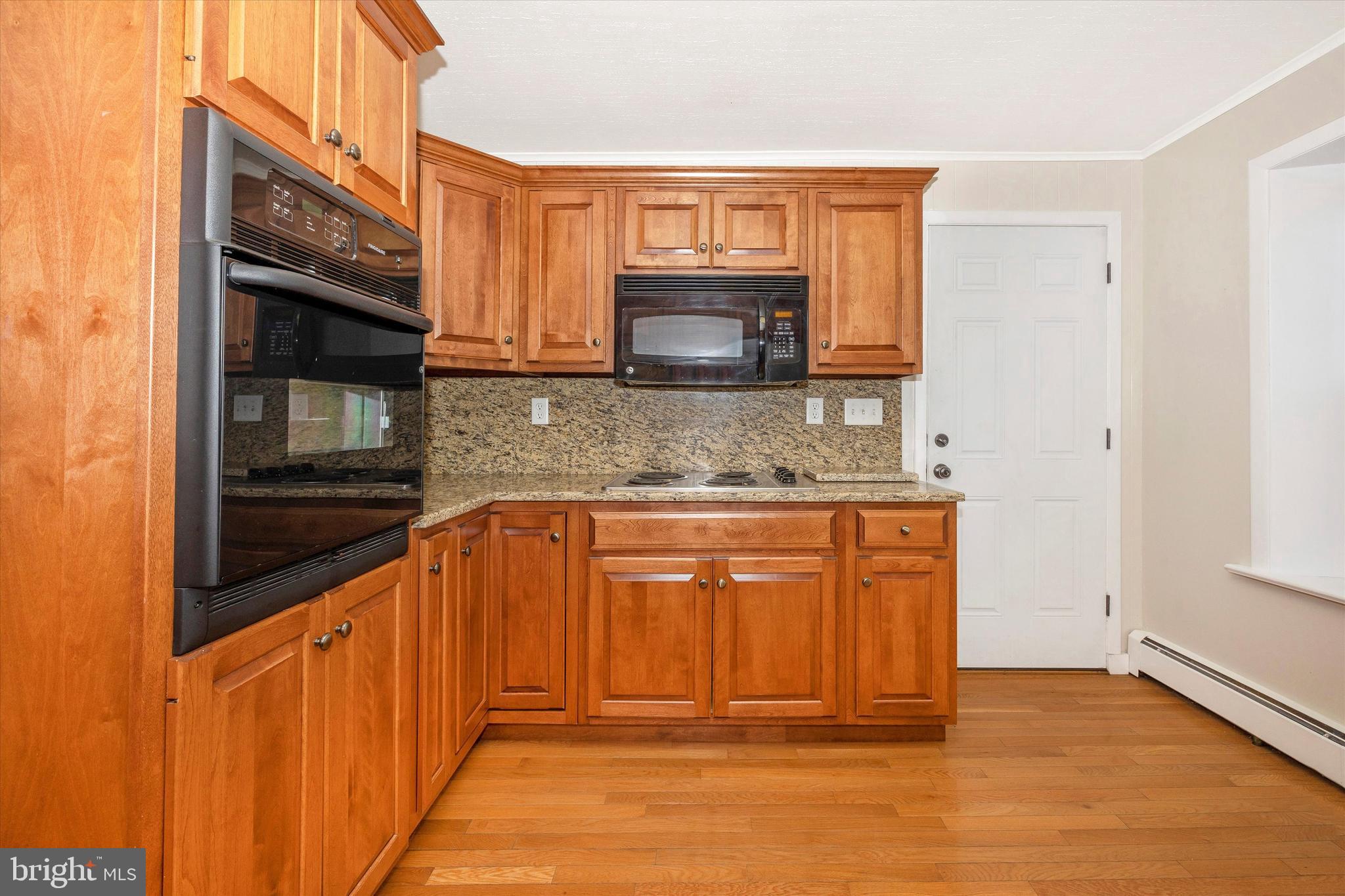 1021 Saffell Road Reisterstown, MD 21136 - Photo 43 of 57 a view of a kitchen cabinets and a wooden floor