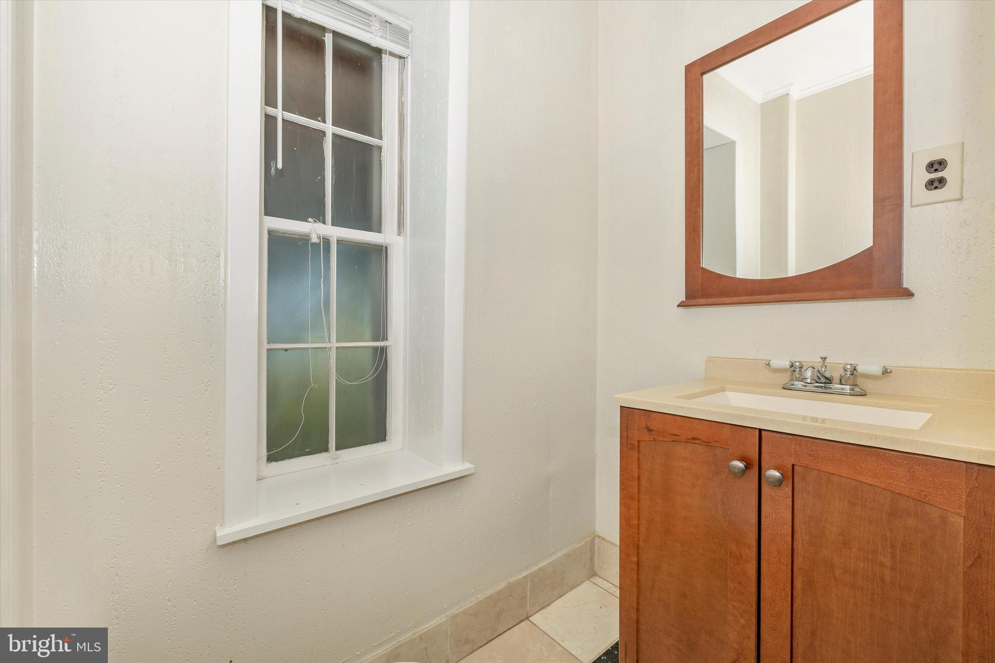 1021 Saffell Road Reisterstown, MD 21136 - Photo 44 of 57 a bathroom with a sink and a mirror