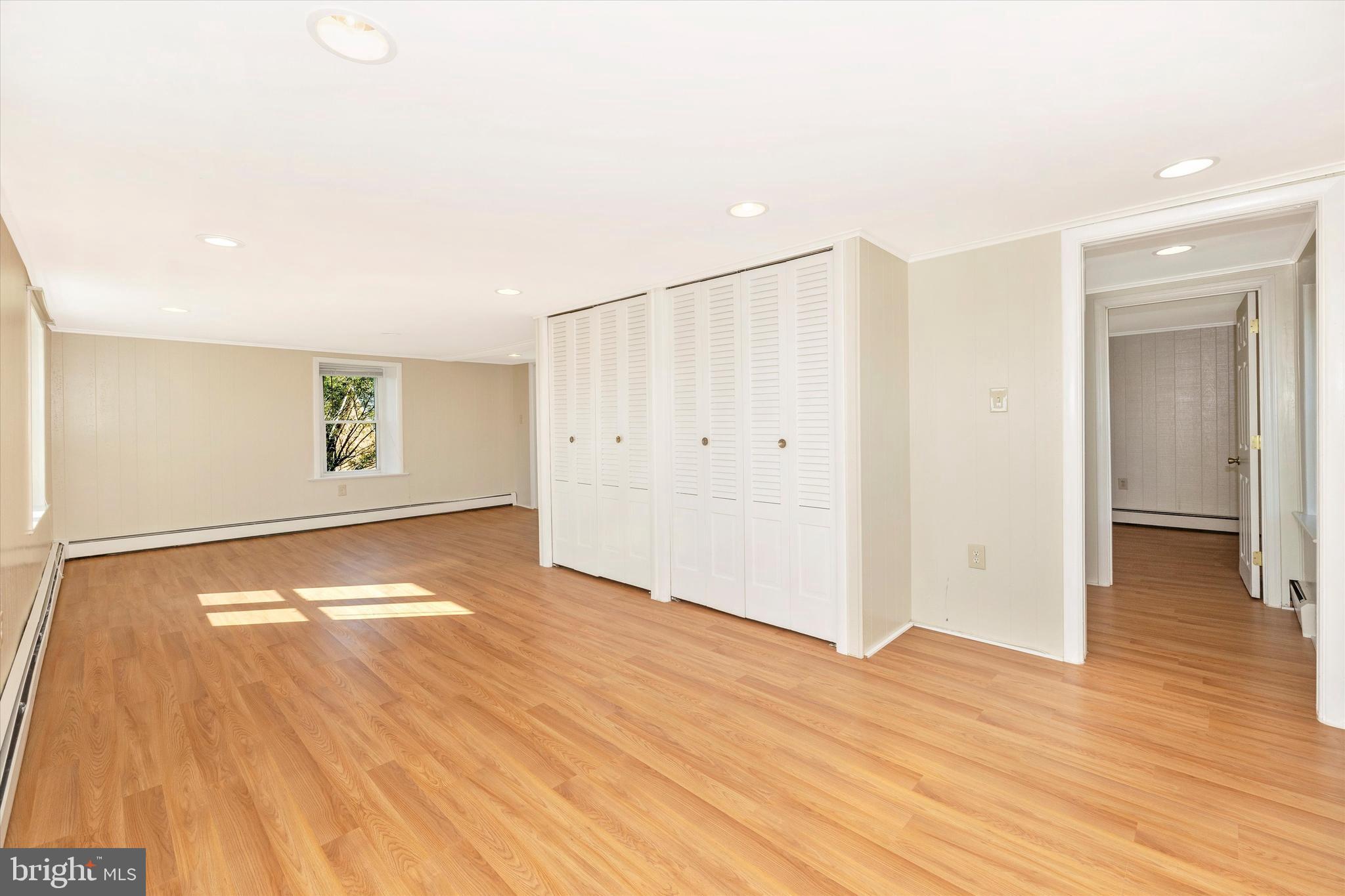 1021 Saffell Road Reisterstown, MD 21136 - Photo 48 of 57 a view of an empty room with wooden floor and a window