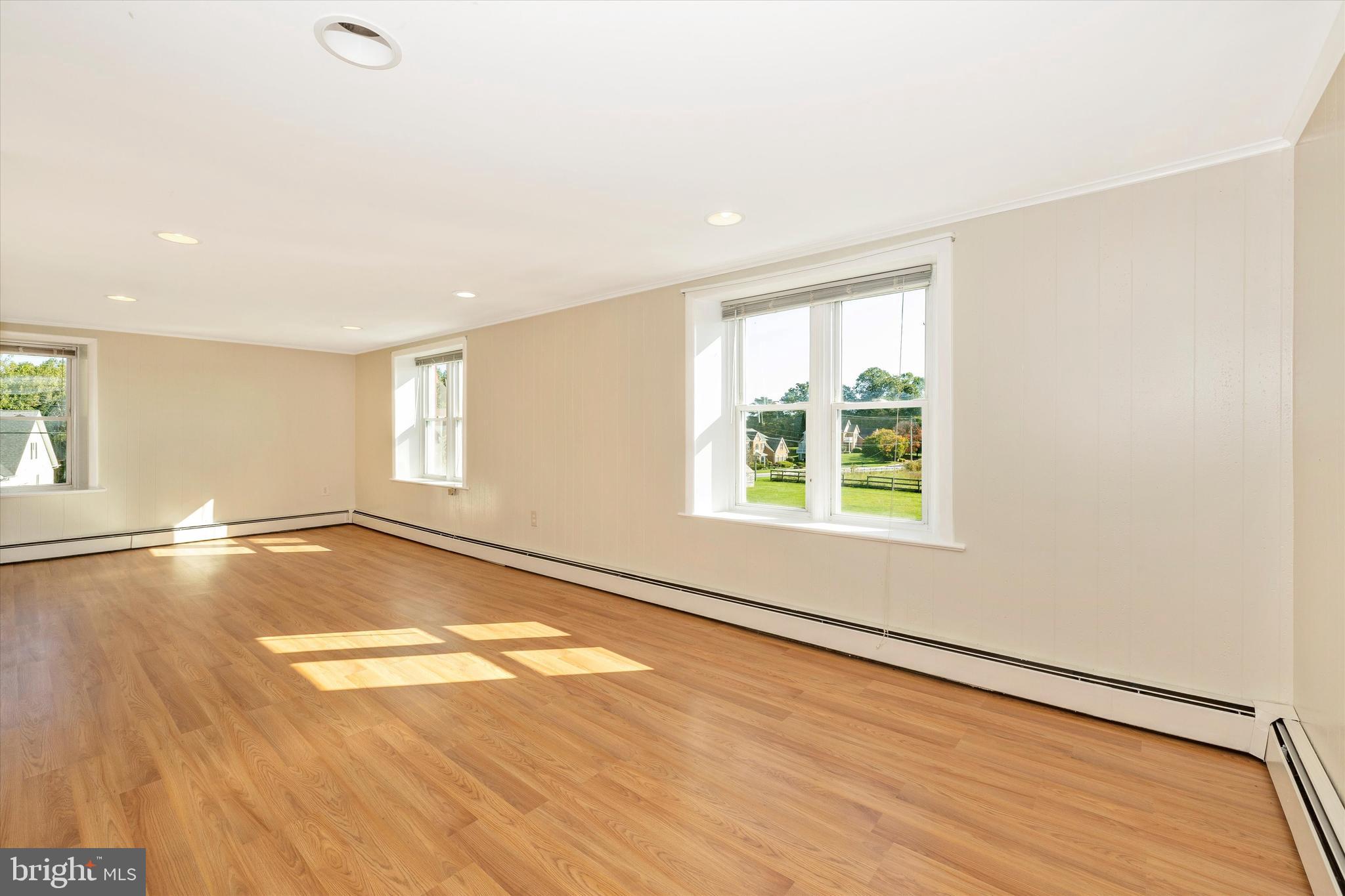 1021 Saffell Road Reisterstown, MD 21136 - Photo 51 of 57 a view of an empty room with wooden floor and a window