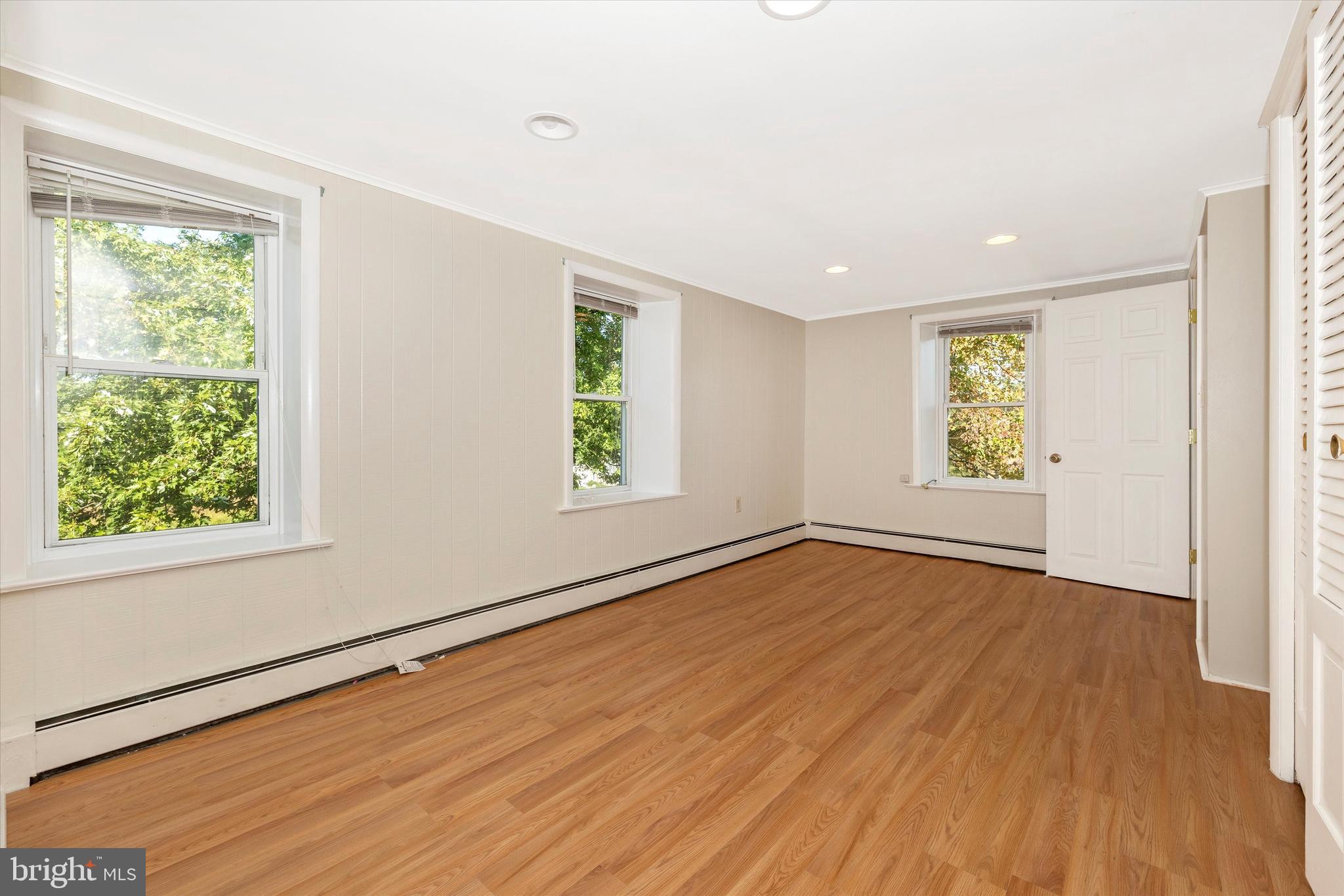 1021 Saffell Road Reisterstown, MD 21136 - Photo 56 of 57 a view of an empty room with wooden floor and a window
