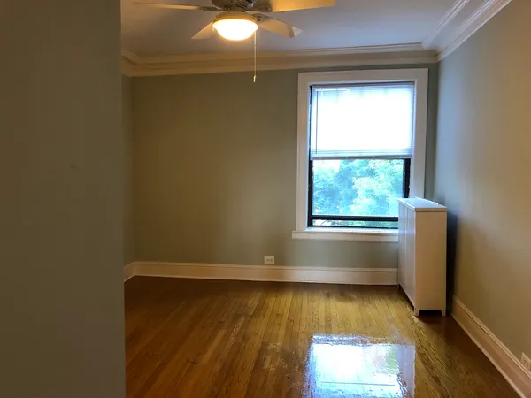 a view of a room that has a window in it