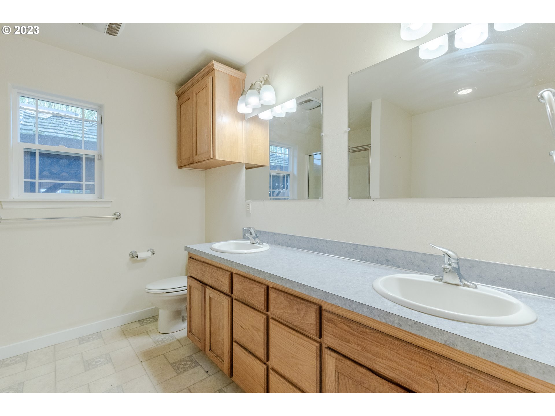 968 S Street Springfield, OR 97477 - Photo 26 of 42 a bathroom with a sink a toilet and a mirror