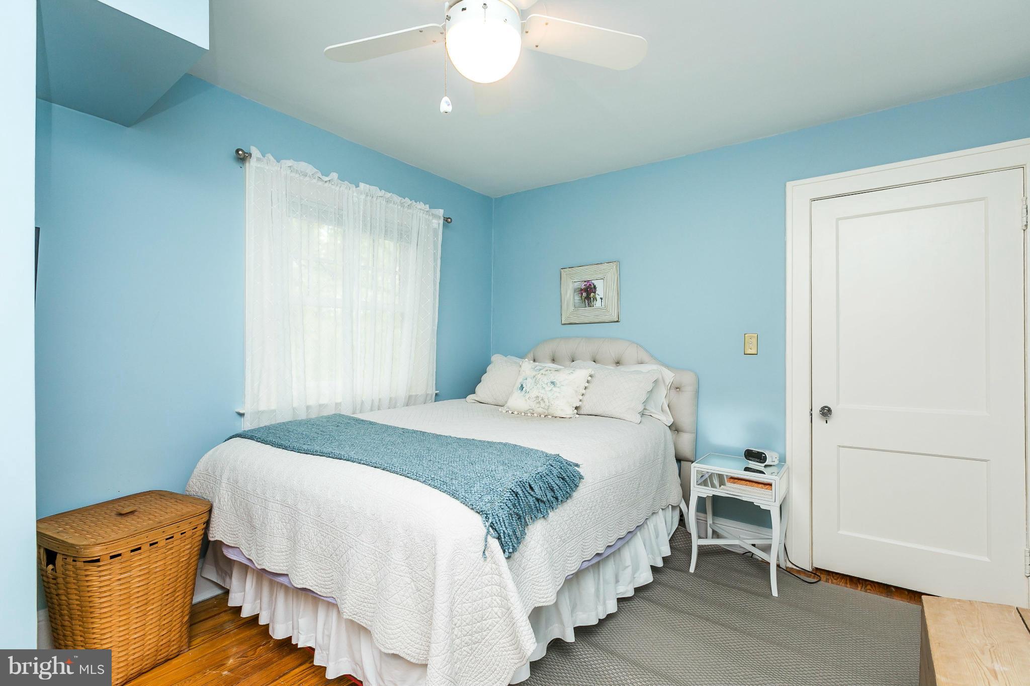 309 Edgevale Road Baltimore, MD 21210 - Photo 22 of 30 a bedroom with a bed and wooden floor