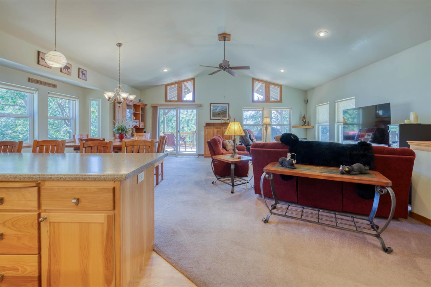 33855 Shaver Springs Road Auberry, CA 93602 - Photo 15 of 41 a living room with furniture a chandelier and a dining table