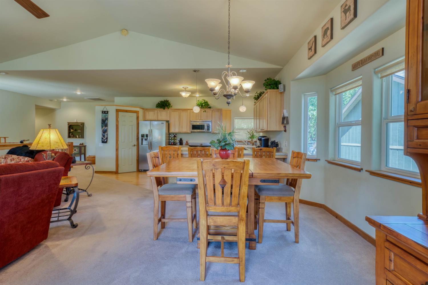 33855 Shaver Springs Road Auberry, CA 93602 - Photo 19 of 41 a view of a dining room with furniture and a chandelier