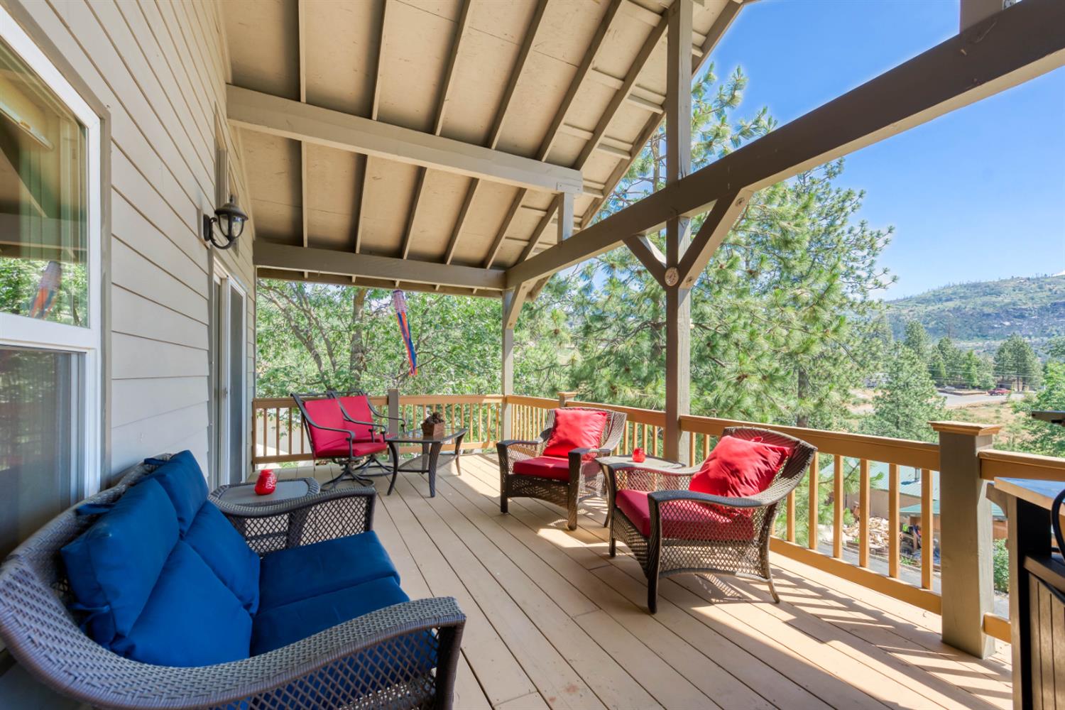 33855 Shaver Springs Road Auberry, CA 93602 - Photo 2 of 41 a living room with furniture and a floor to ceiling window