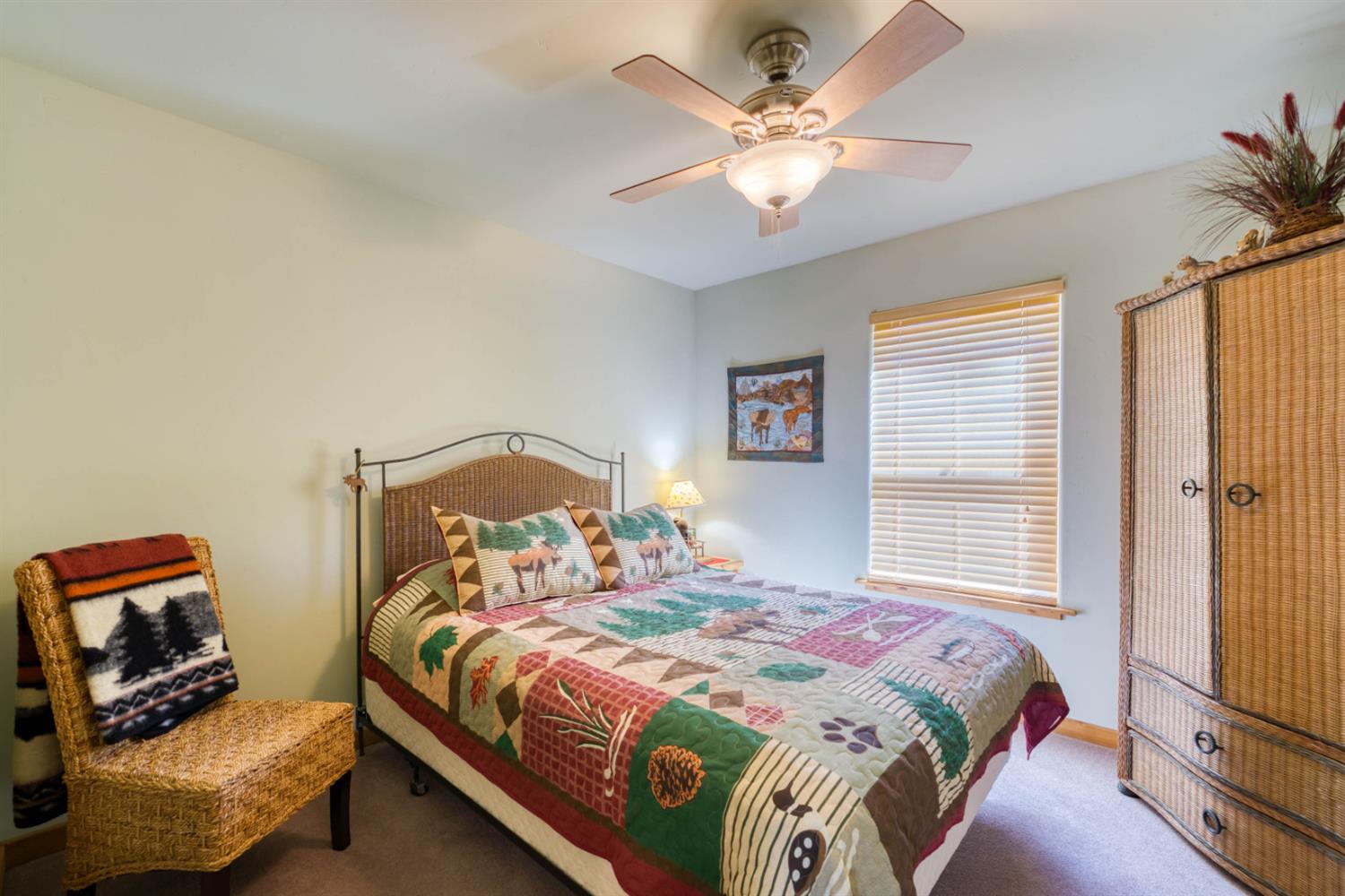 33855 Shaver Springs Road Auberry, CA 93602 - Photo 23 of 41 a bedroom with a bed and a chandelier