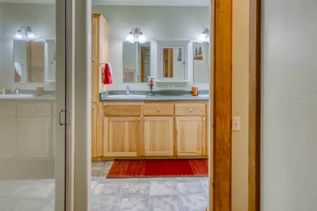 a bathroom with a sink and a mirror