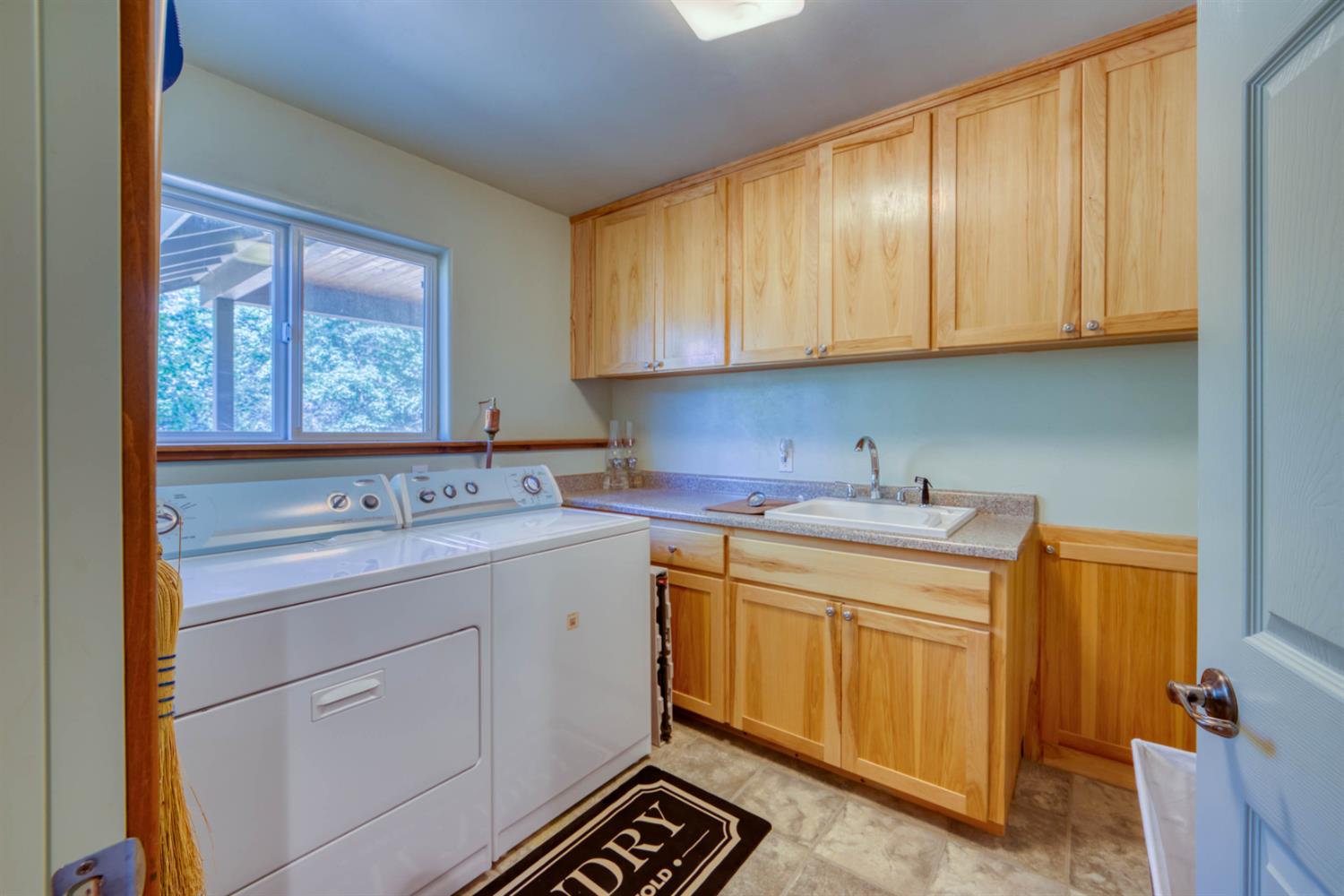 33855 Shaver Springs Road Auberry, CA 93602 - Photo 28 of 41 a utility room with stainless steel appliances granite countertop a sink and a cabinets