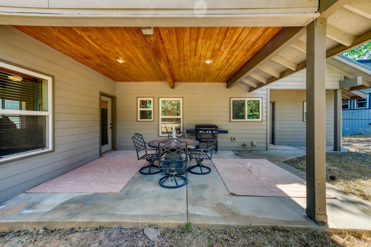 33855 Shaver Springs Road Auberry, CA 93602 - Photo 31 of 41 a view of a patio with table and chairs and potted plants