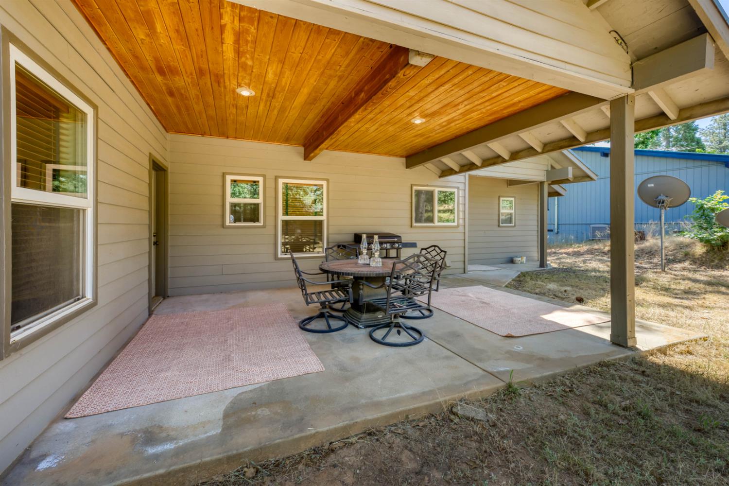33855 Shaver Springs Road Auberry, CA 93602 - Photo 32 of 41 a view of a patio with table and chairs in patio