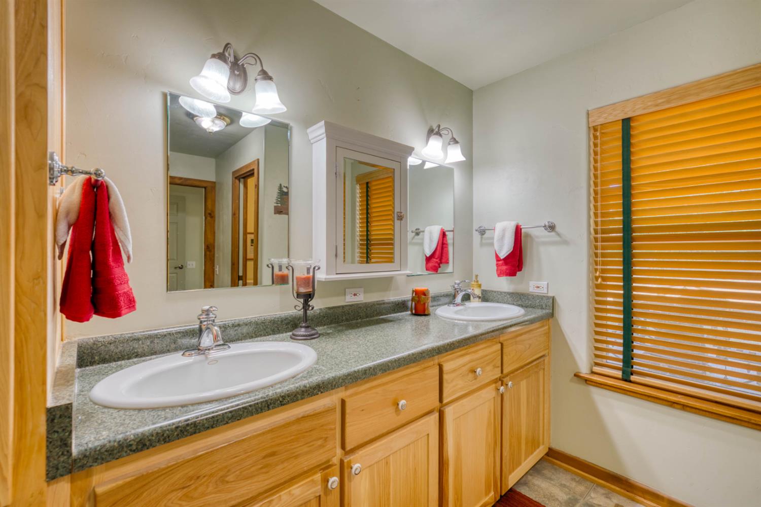 33855 Shaver Springs Road Auberry, CA 93602 - Photo 32 of 41 a bathroom with a sink vanity and a mirror