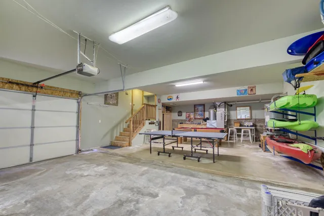 a view of a play room with furniture and a garage